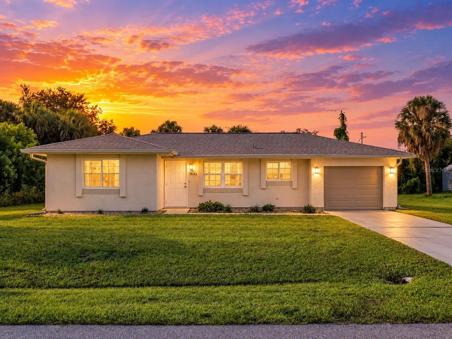 FrontExterior_18103WindsweptAvenue_PortCharlotte_Twilight_Daylight.jpg