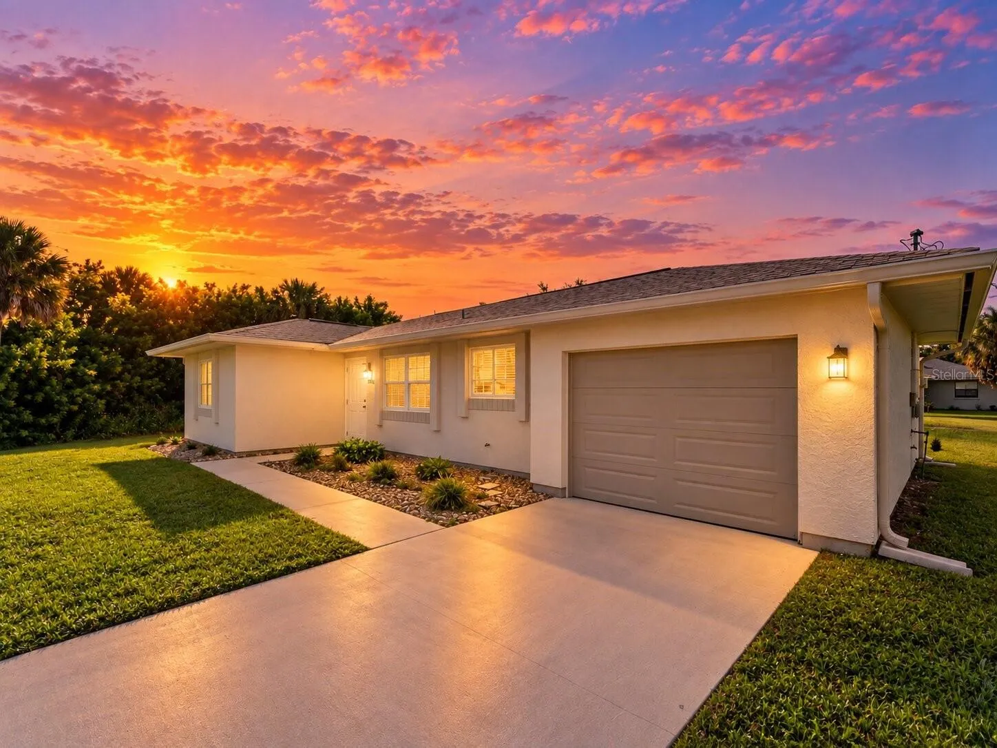 FrontExterior_18103WindsweptAvenue_PortCharlotte_Driveway_Twilight.jpg