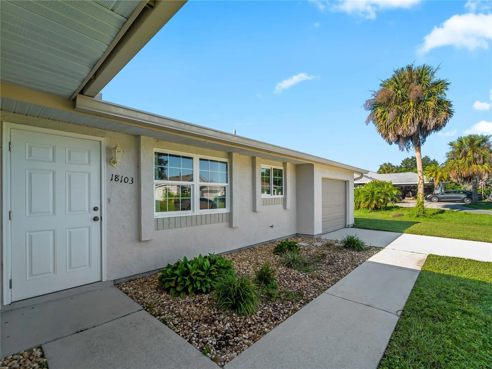 FrontExterior_18103WindsweptAvenue_PortCharlotte_Landscaping_Entry.jpg