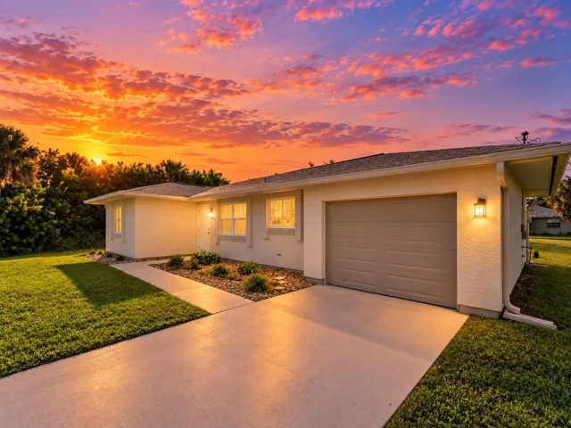 FrontExterior_18103WindsweptAvenue_PortCharlotte_Driveway_Twilight.jpg