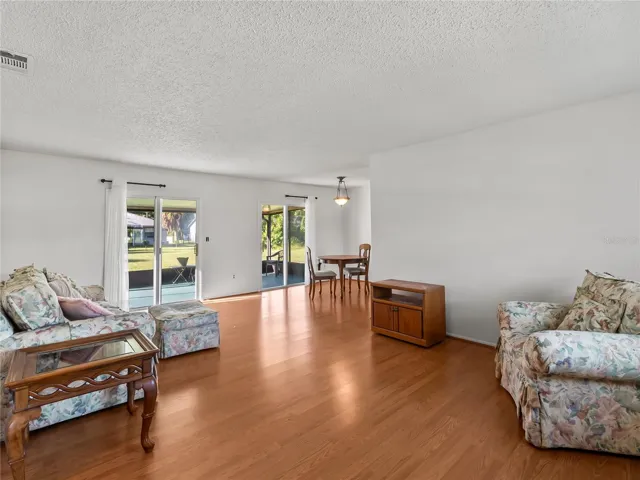 DiningLiving_18103WindsweptAvenue_PortCharlotte_OpenConcept_Corner.jpg