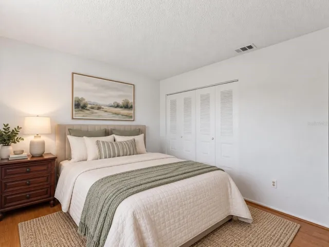 Virtually_Staged_Bedroom_18103WindsweptAvenue_PortCharlotte_Closet_Corner.jpg