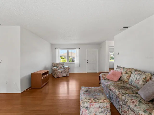 LivingRoom_18103WindsweptAvenue_PortCharlotte_NaturalLight_Corner.jpg