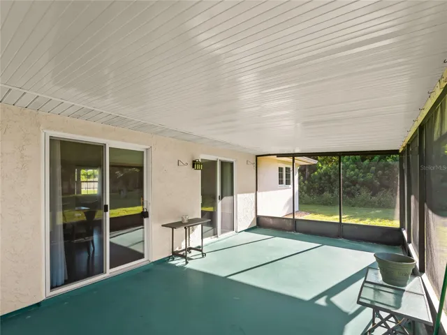 ScreenedLanai_18103WindsweptAvenue_PortCharlotte_CoveredPatio_Corner.jpg