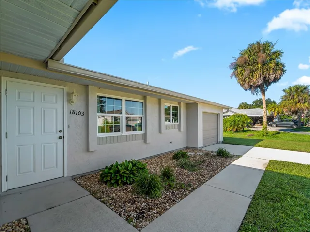 FrontExterior_18103WindsweptAvenue_PortCharlotte_Landscaping_Entry.jpg