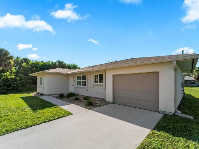 FrontExterior_18103WindsweptAvenue_PortCharlotte_TwoCarGarage_Corner.jpg