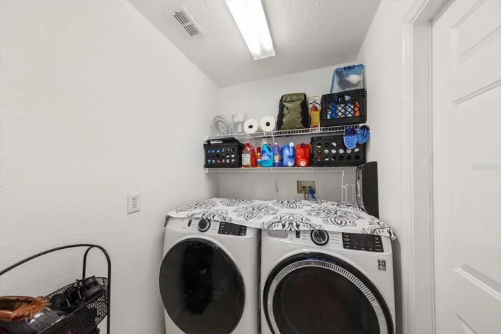 Inside laundry room with door out to the garage