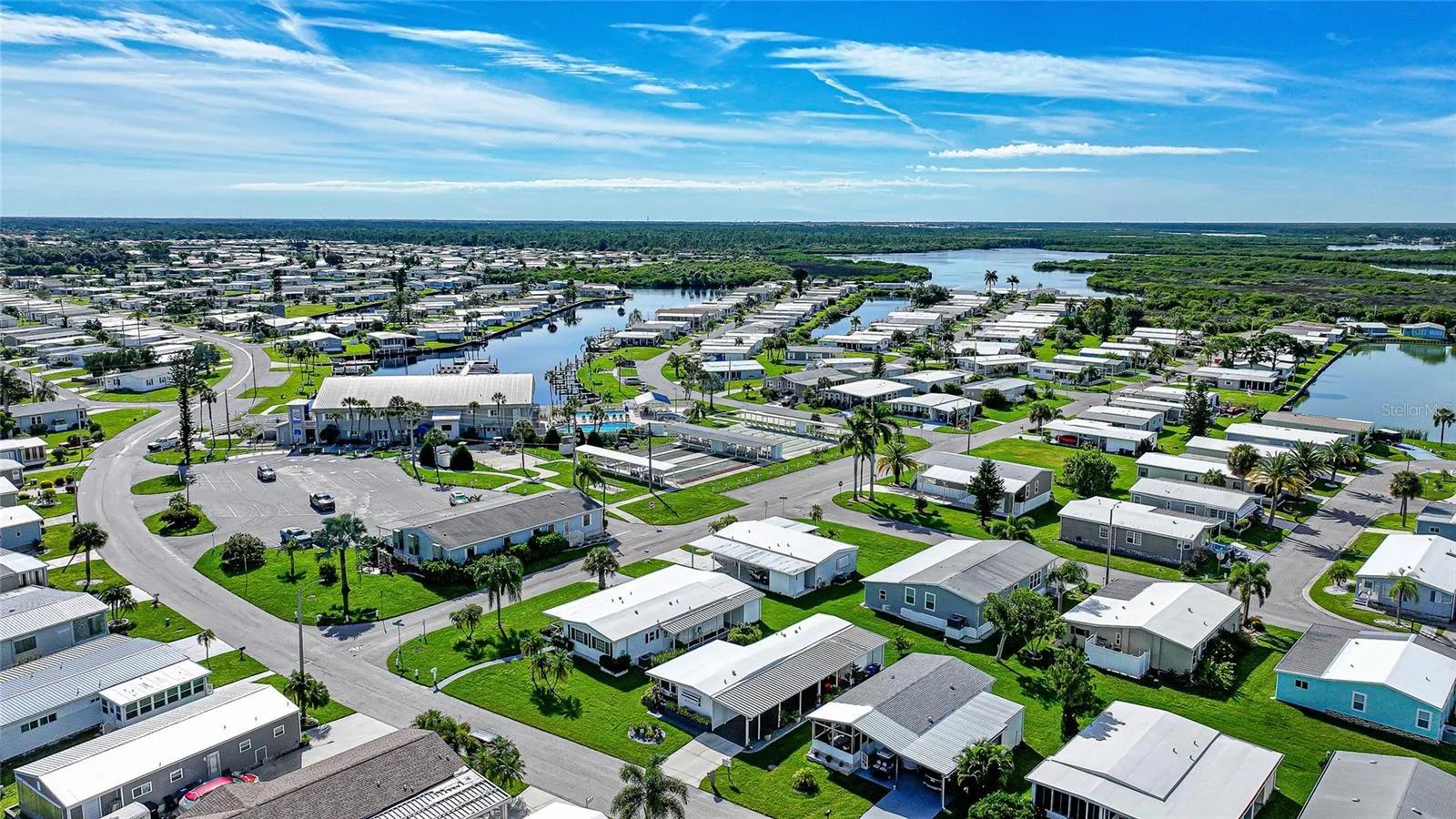 Conveniently located near the clubhouse, pools, and marina