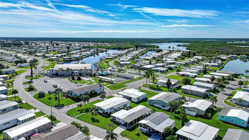 Conveniently located near the clubhouse, pools, and marina