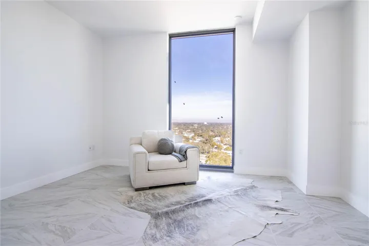 Secondary bedroom with floor to ceiling window