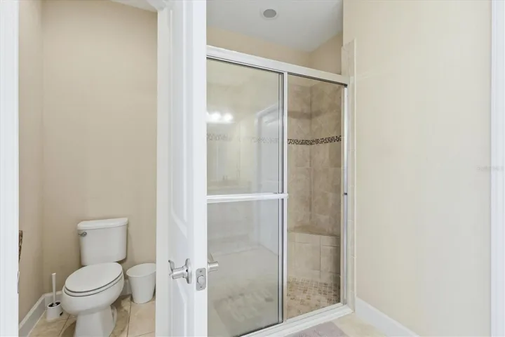 Pirmary en-suite walk-in glass enclosed shower