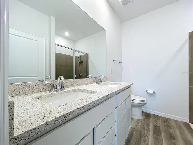 DOUBLE VANITY IN PRIMARY BATHROOM