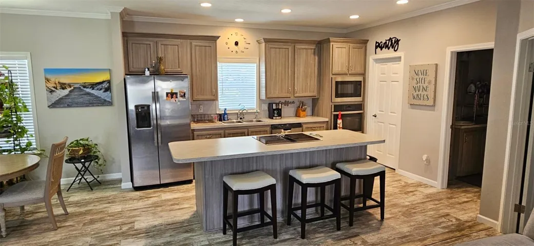 Kitchen showing cooktop and breakfast bar