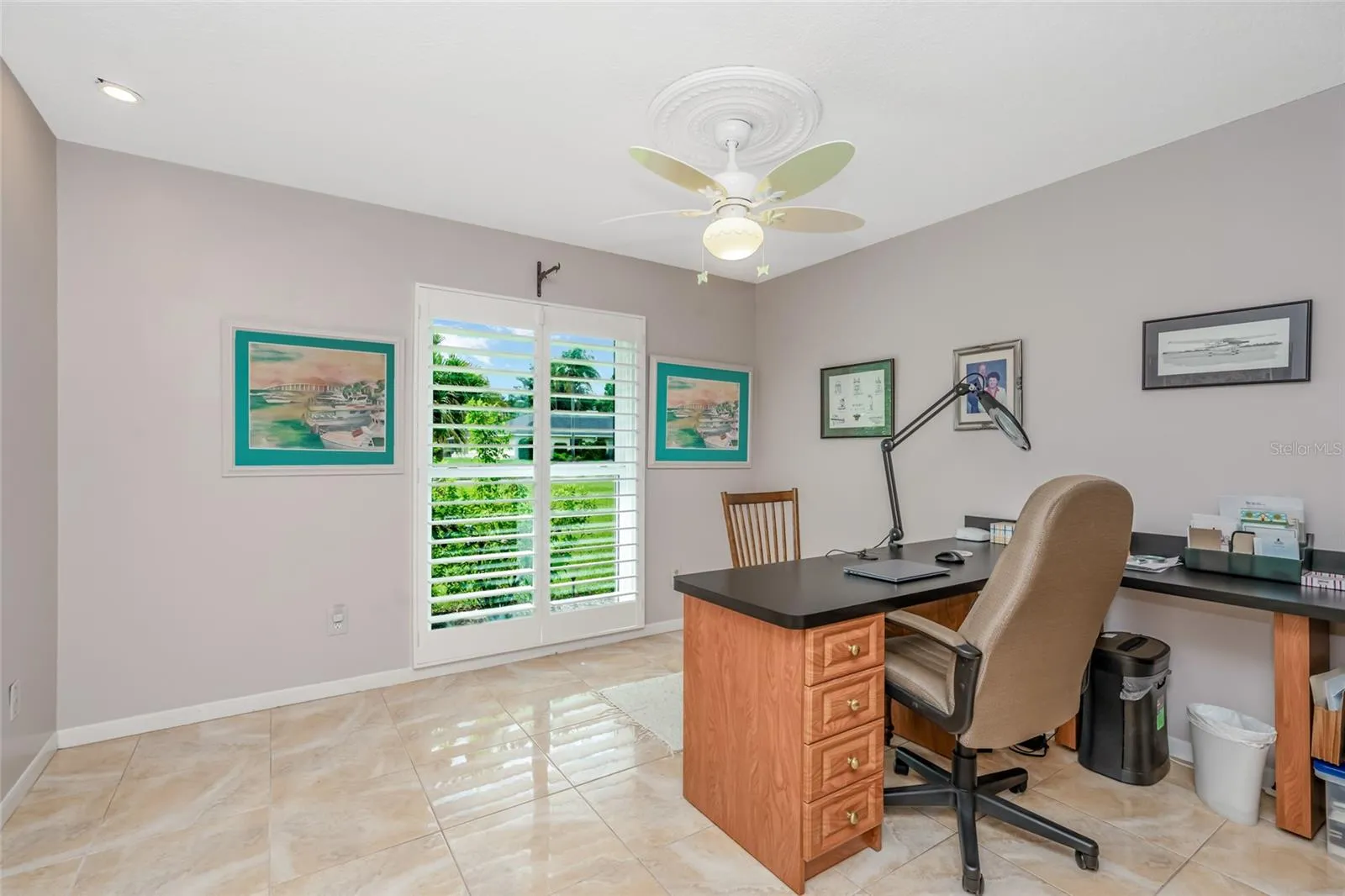 Bedroom 4, currently configured with built in office furniture.