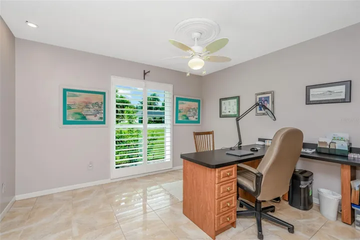 Bedroom 4, currently configured with built in office furniture.
