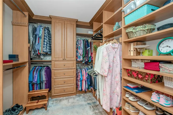 Massive Walk in with custom closet organizers.