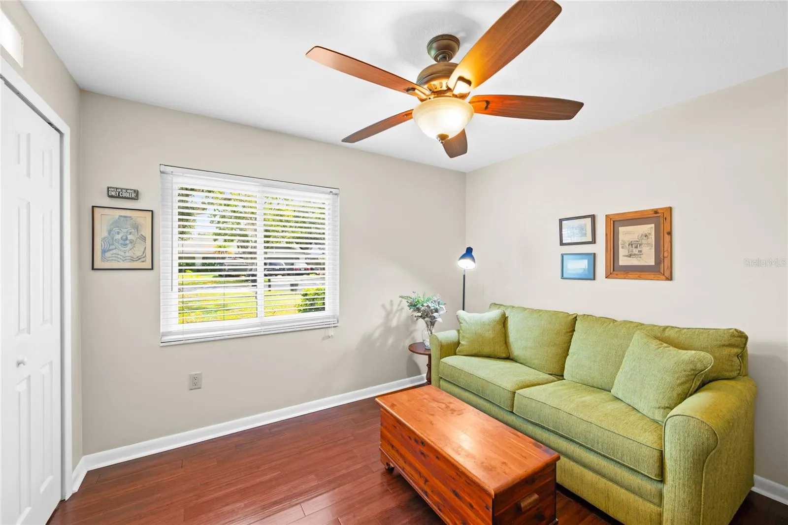 Bedroom 4 used as den with built-in closet and bamboo flooring.
