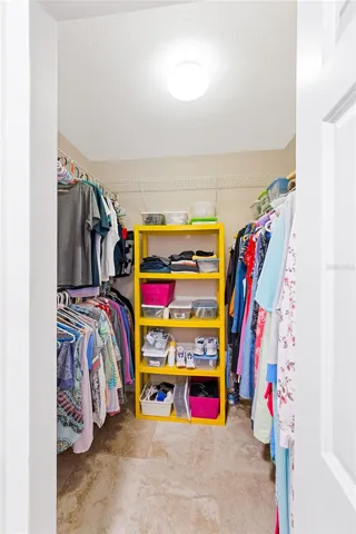 Primary walk-in closet; primary bedroom also has a built in closet.