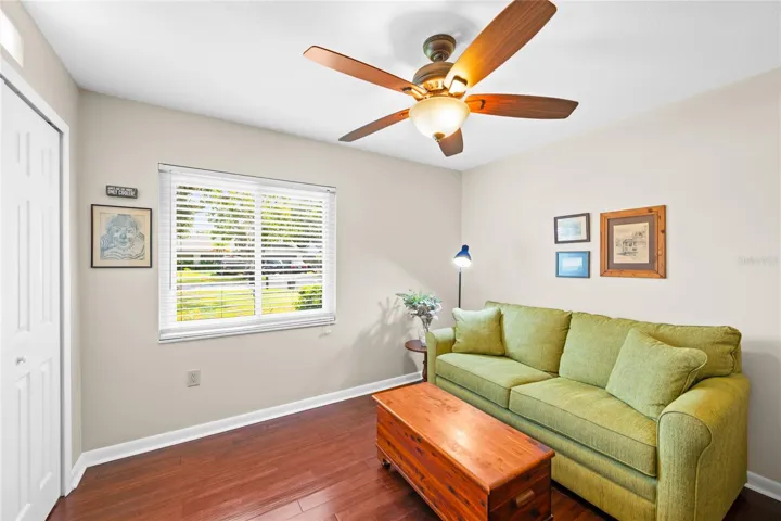 Bedroom 4 used as den with built-in closet and bamboo flooring.