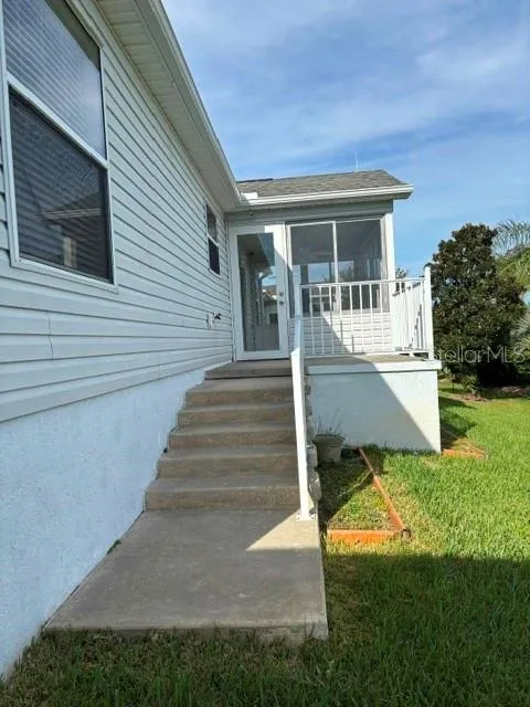 Steps to patio and enclosed lanai