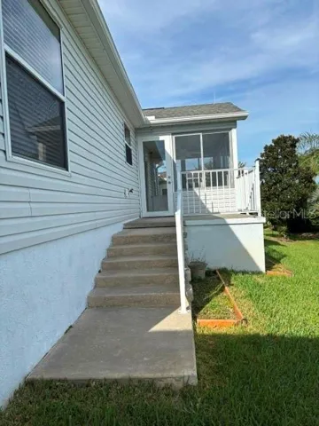 Steps to patio and enclosed lanai