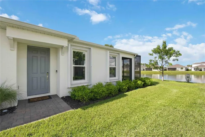 Front Entrance (side of home) (note hurricane shutters on windows)
