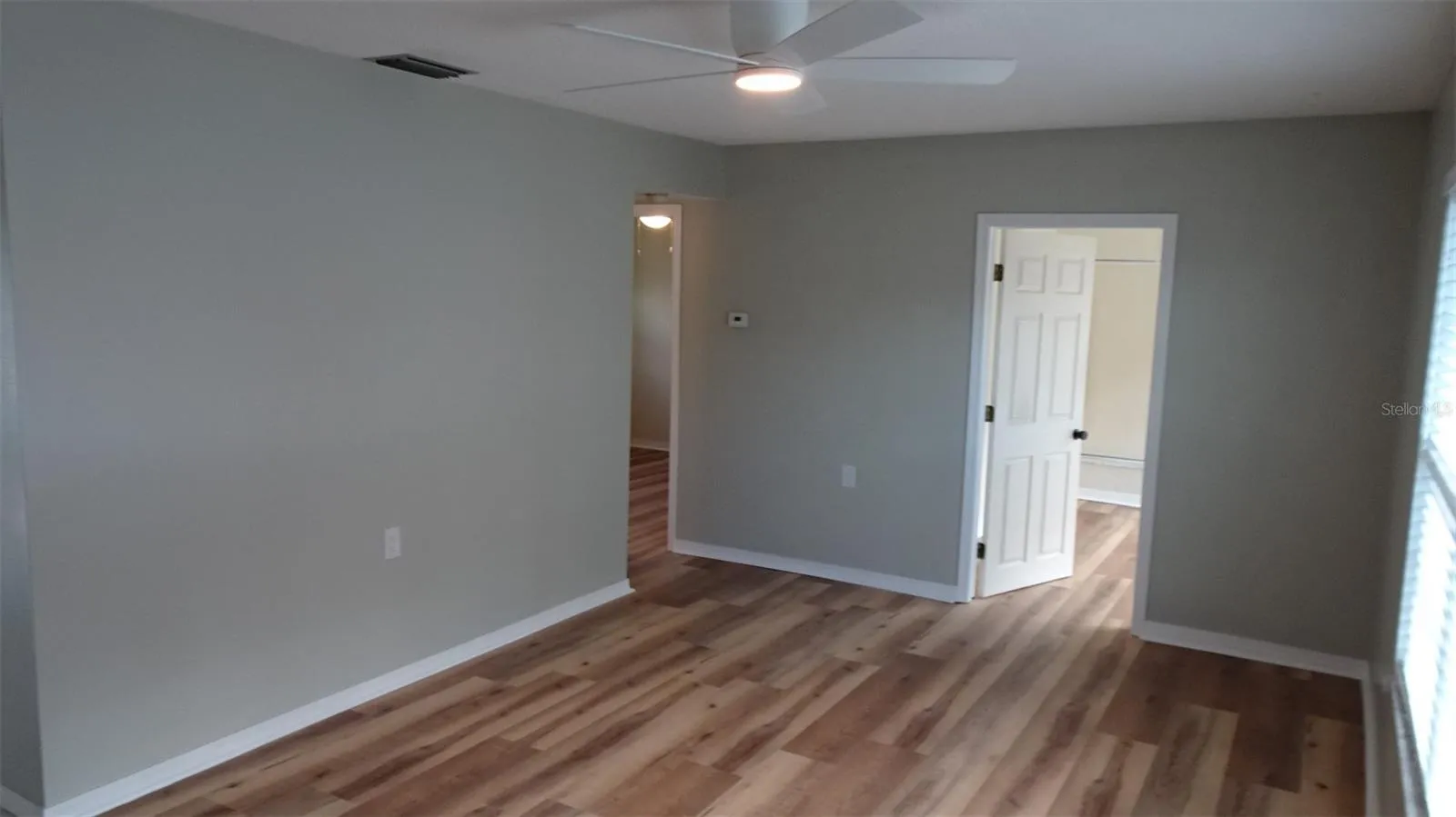 White door leads into front den/office