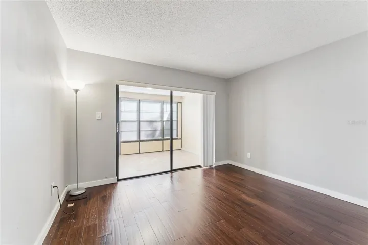 Downstairs bedroom with access to enclosed patio/flex space - great for an office!