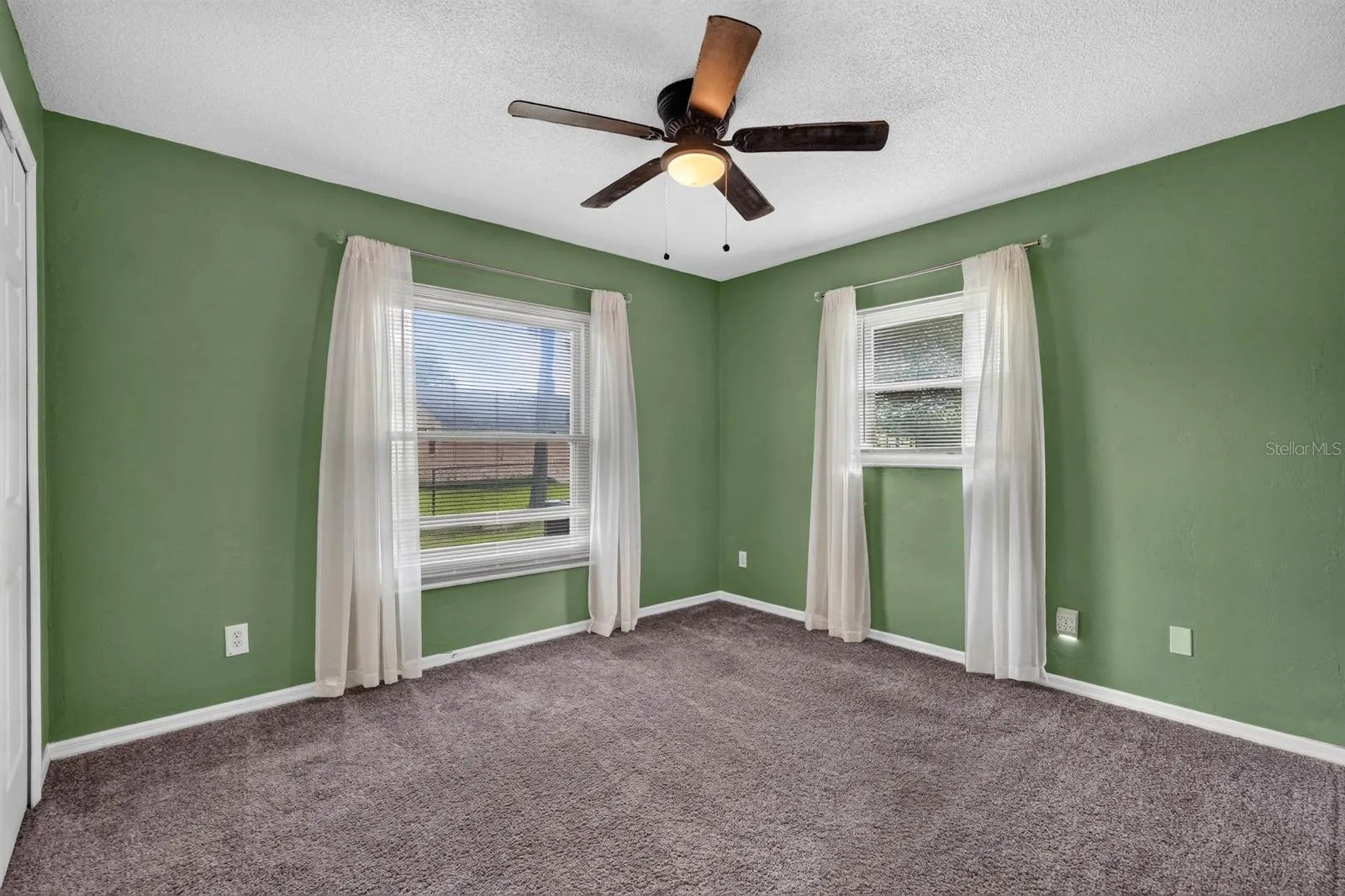 Bedroom with Green Accent Walls