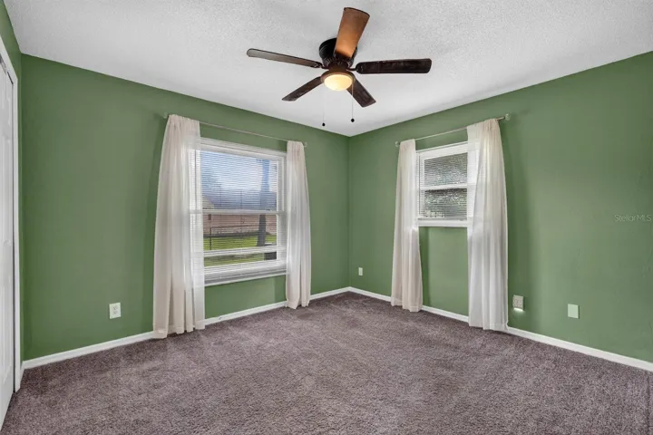 Bedroom with Green Accent Walls