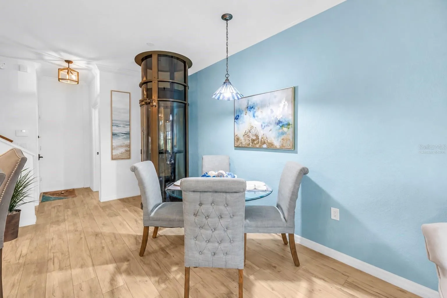 Virtually Staged: Private in-home elevator is thoughtfully integrated into the main living level.