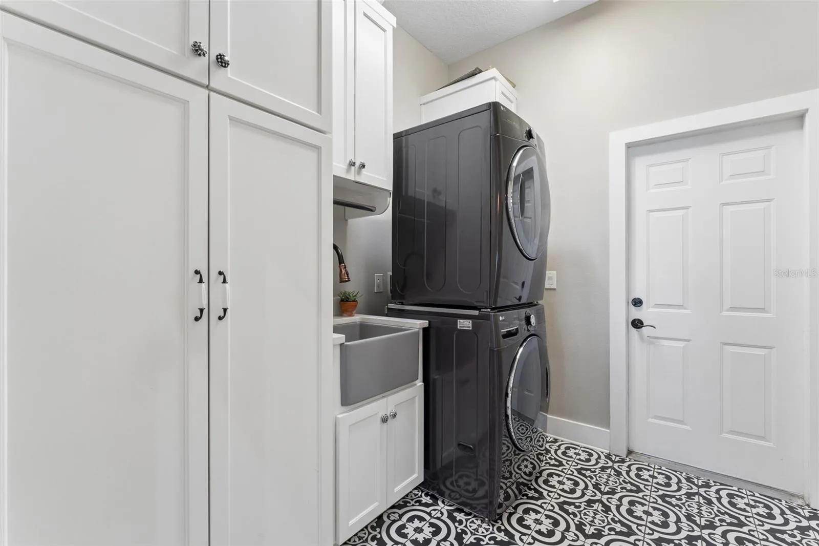 Laundry room has tons of storage.