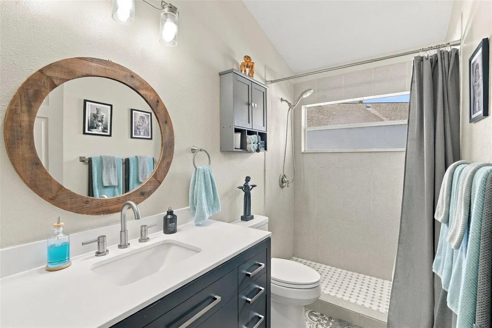 Guest bath w/walk-in shower and frosted lower window.
