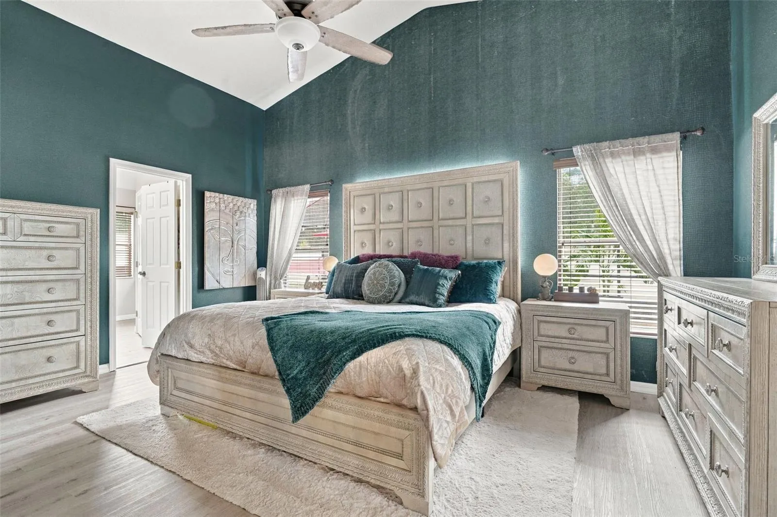 This primary bedroom suite is incredible! Look at those ceilings!