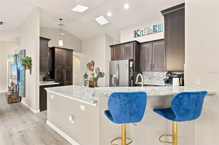 The split breakfast bar allows the kitchen to flow seamlessly to the dining area.