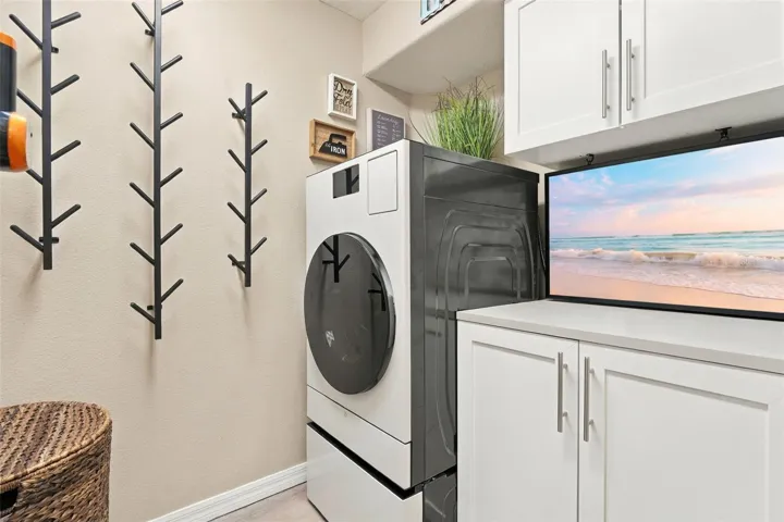 This washer/dryer combo in the indoor laundry room stays.