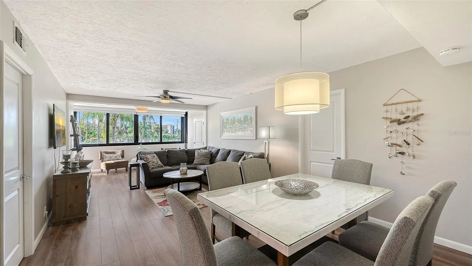 Dining and living room overlooking lake and Gulf