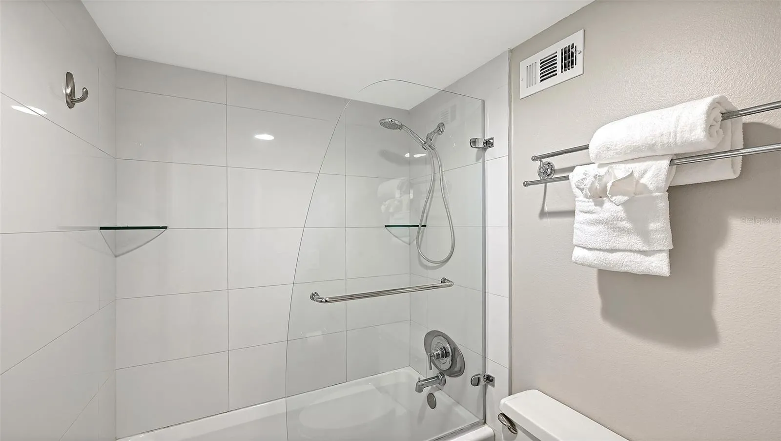 Primary bathroom, shower/tub with glass door