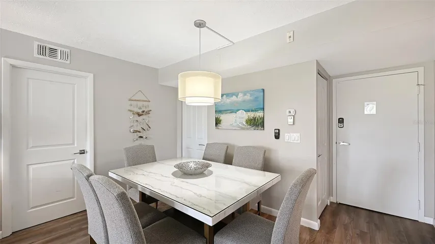 Dining area, door shown is to primary bedroom