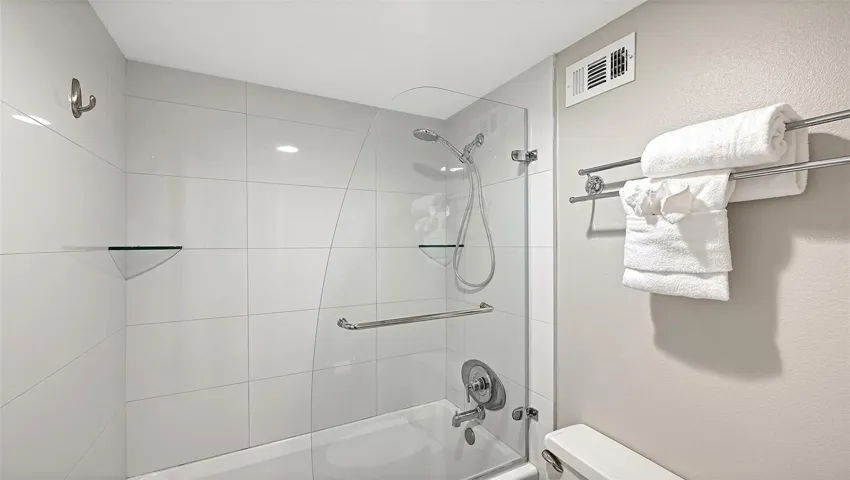 Primary bathroom, shower/tub with glass door