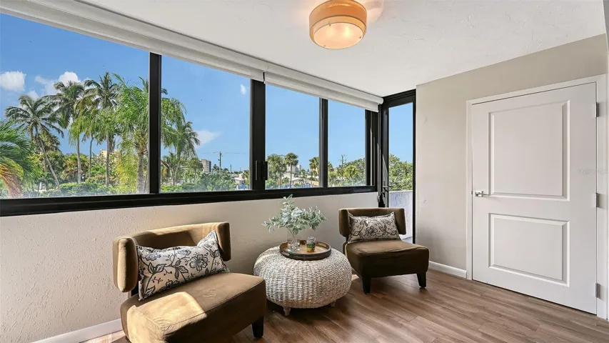 Bonus sitting area for quiet reading, door shown is to primary bedroom