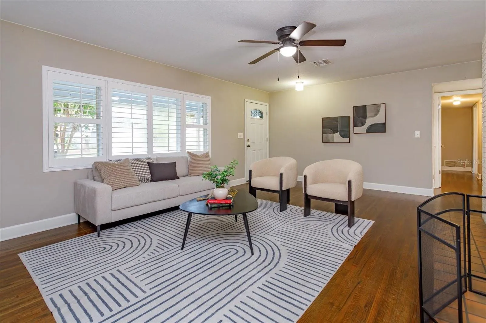 Hardwood floors throughout and plantation shutters