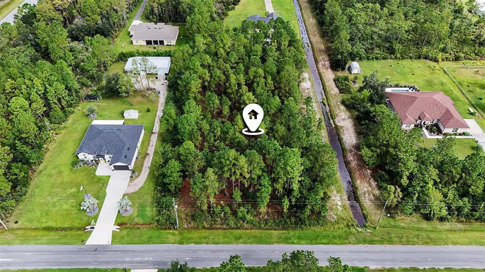 1.24 acre lot with 180-foot frontage!