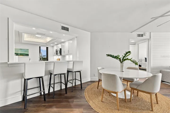 Kitchen bar overlooks the Dining Area and Living Room