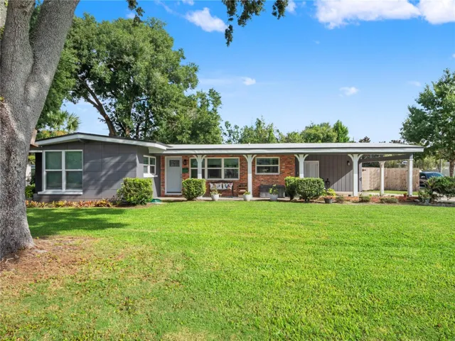 Covered front porch entry and huge corner lot.