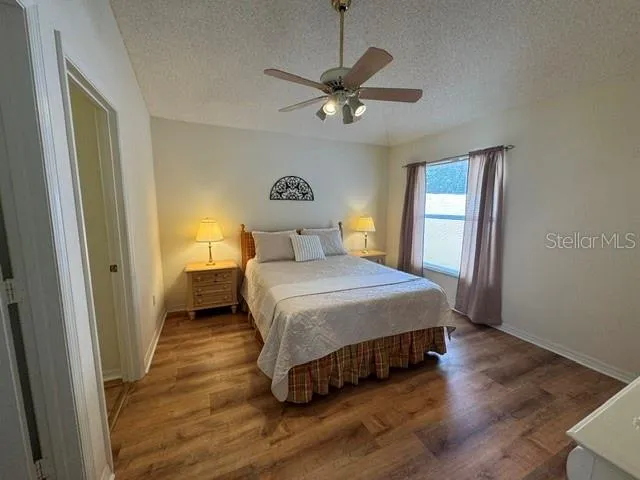 Primary Bedroom with fan and window