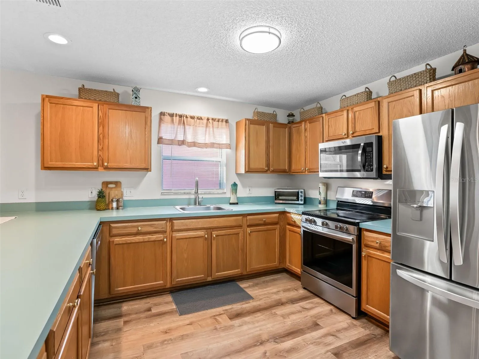 Kitchen has lots of cabinets