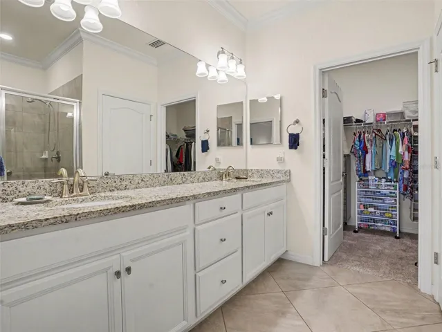 Primary Bathroom with Walk-In Closet and Dual Vanity