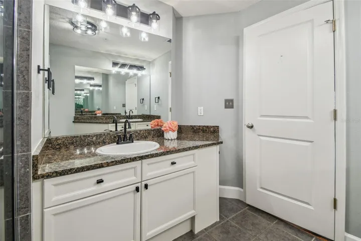Primary bathroom with dual vanities.