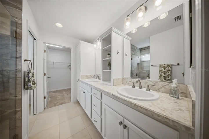 Primary Bathroom wi Walk-In-Shower and Large Walk-In Closet